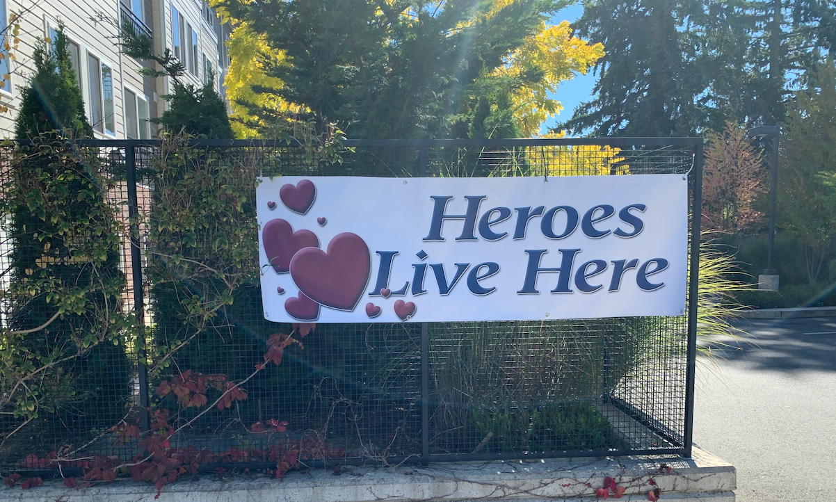 Sign Saying Heroes Work Here